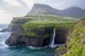 beautiful-landscape-shot-rocky-shore-covered-greenery-body-water-2376x1584-1188x792.jpg